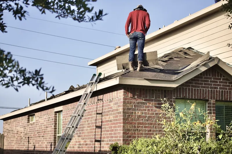 Professional roofer working on a residential roof in North Lakewood